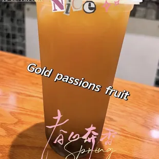 a glass of juice on a table