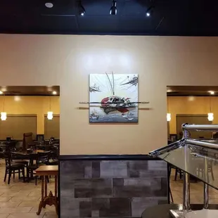 a dining area with tables and chairs