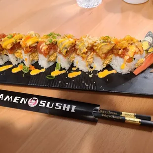 Tokyo House Roll - Spicy CA roll topped with spicy tuna, tempura eel, with eel sauce, spicy mayo, scallion, and caviar