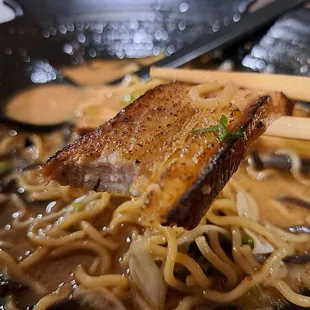 Tonkatsu Black Garlic RamenTonkotsu or Tonkatsu Black Garlic Ramen - Close-up of chashu pork