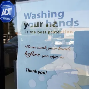 a hand washing your hands sign