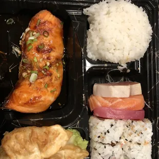 Teriyaki grilled salmon with sashimi, spicy tuna roll, &amp; gyoza