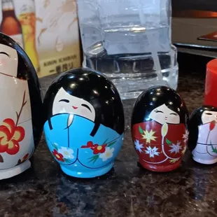 a group of nesting dolls on a counter