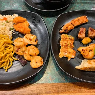 Fried rice, low mein, shrimp and chicken (left) and chicken, salmon, beef, calimari, dumpling, and grilled sardine (?) (right)