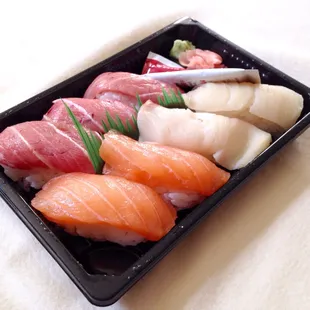 Nigiri lunch box. Salmon, yellowtail and fatty tuna.