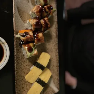 a plate of sushi and a cup of coffee