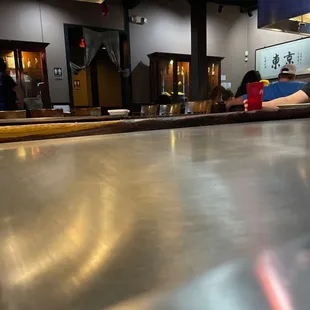a woman sitting at the bar