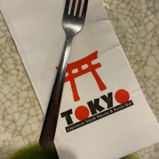 a fork on a napkin