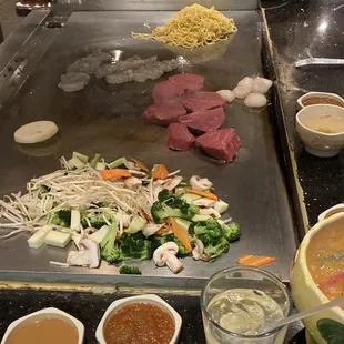 a grill with various foods on it