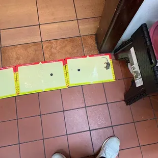 a person standing on a tiled floor