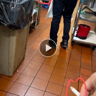 a person holding a pair of scissors