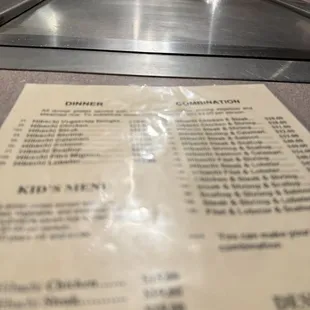 a menu on a conveyor belt