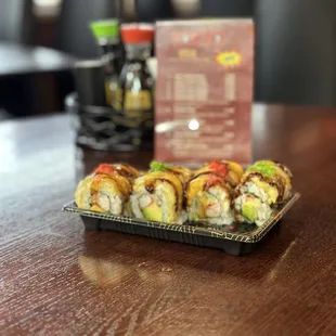 a plate of sushi rolls