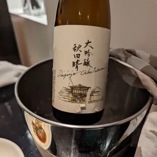 a bottle of wine in a bowl