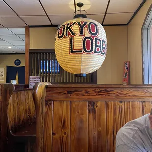 a man sitting at a table in a restaurant