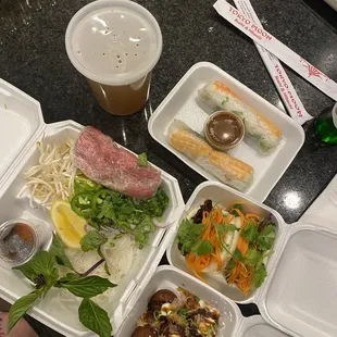 Pho Tai (Rare Eye Round Steak), octopus dumplings, pork belly bun, fresh spring rolls