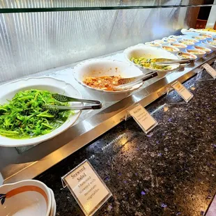 Seaweed salad, kimchi and some other delicious sides.