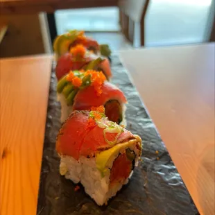 a long line of sushi rolls
