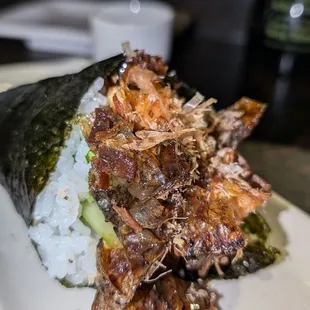 Salmon Skin Hand Roll with Bonito flakes.