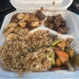 Hibachi steak and chicken with fried rice and veggies