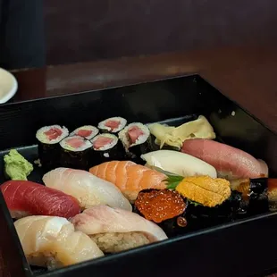 a plate of sushi and a bowl of salad