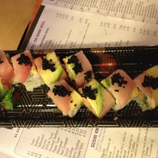 TNT roll spicy yellowtail crunch cilantro jalapeno topped with yellow tail avocado sweet jalapeno dressing