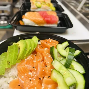 salmon, avocado, cucumbers, and rice