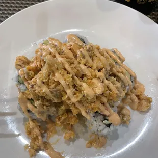 This is the delicious volcano roll. The stuff on top is like a bread crumb overall super delicious.