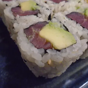 Red tuna avocado roll, close-up.