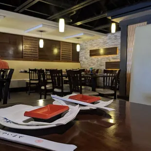 plates of sushi on a table in a restaurant