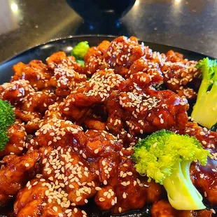 Closeup of the Crispy Sesame Beef with yummy rice in the background.