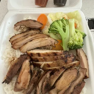 Teriyaki Chicken Bowl with white rice and vegetables .