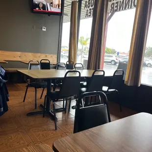a dining area with tables and chairs