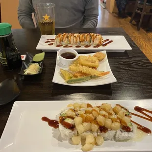 Baked scallop roll, vegetable tempura, and Alaska roll.