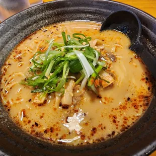 a bowl of ramen on a table