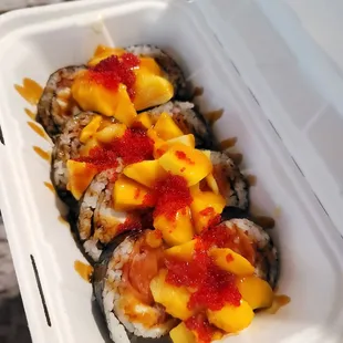 Always sunny roll. Smoked salmon, cream cheese, and mangos. It's like a Philly roll with a twist .