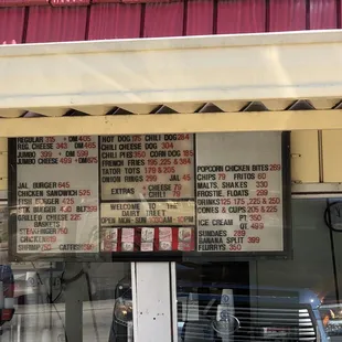 a menu on the outside of the store
