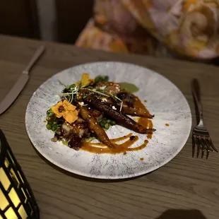 Scallops with roasted carrots and vegetables