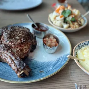 32 oz rib-eye (tomahawk steak) and 2 sides (roasted cauliflower and olive oil potato purée) both excellent!