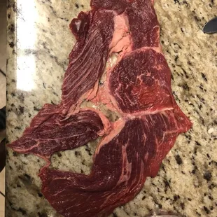 a piece of beef on a cutting board