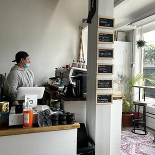 a man working at a coffee shop