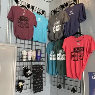 t - shirts hanging on a wall