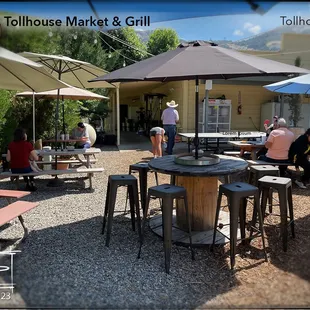 Outside seating complete with ping pong and corn hole.