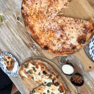 Lower pie is the Margerita and the upper pie is the cheese. Epic pizza comes out at 900 degrees from Peters wood fired pizza oven on weekend