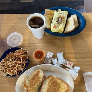 a plate of food and a cup of coffee