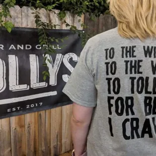 a woman standing in front of a sign