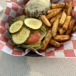 1/2 lb cheeseburger cooked medium in a Kaiser roll with fries