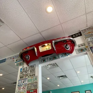 a red car on top of a mirror