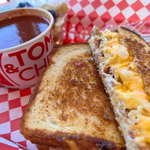 a grilled cheese sandwich with macaroni and cheese