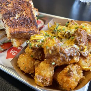 a grilled cheese sandwich and fried tater tots